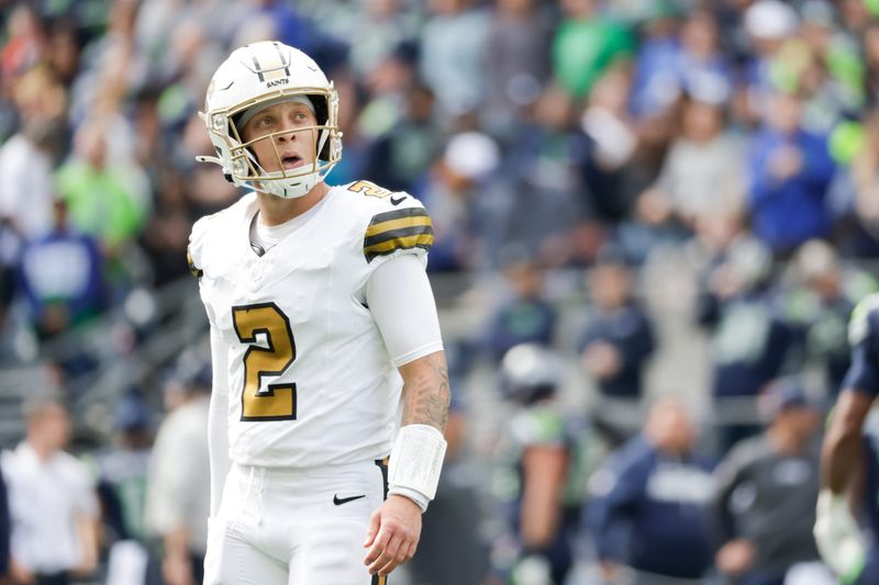 Sep 21, 2025; Seattle, Washington, USA; New Orleans Saints quarterback Spencer Rattler (2) looks at the scoreboard in between plays against the Seattle Seahawks at Lumen Field. Mandatory Credit: Joe Nicholson-Imagn Images