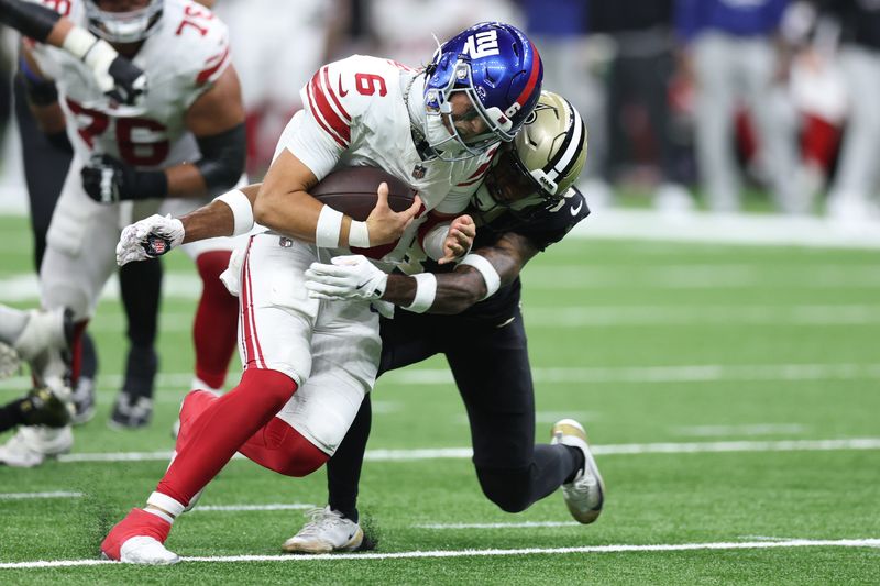 Oct 5, 2025; New Orleans, Louisiana, USA; New York Giants quarterback Jaxson Dart (6) runs with the ball against the New Orleans Saints during the second half at Caesars Superdome. Mandatory Credit: Stephen Lew-Imagn Images
