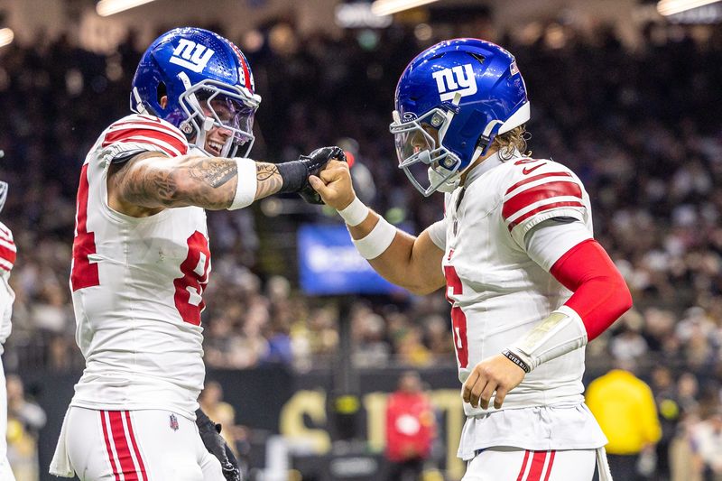 Oct 5, 2025; New Orleans, Louisiana, USA; New York Giants tight end Theo Johnson (84) and quarterback Jaxson Dart (6) react to a touchdown against New Orleans Saints during the first half at Caesars Superdome. Mandatory Credit: Stephen Lew-Imagn Images