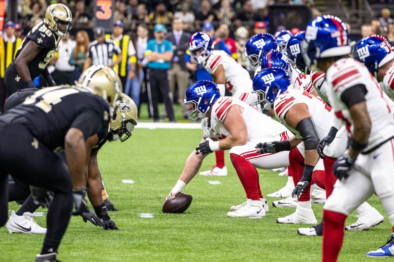 Oct 5, 2025; New Orleans, Louisiana, USA; New York Giants center John Michael Schmitz (61) lines up against the New Orleans Saints defense during the first half at Caesars Superdome. Mandatory Credit: Stephen Lew-Imagn Images