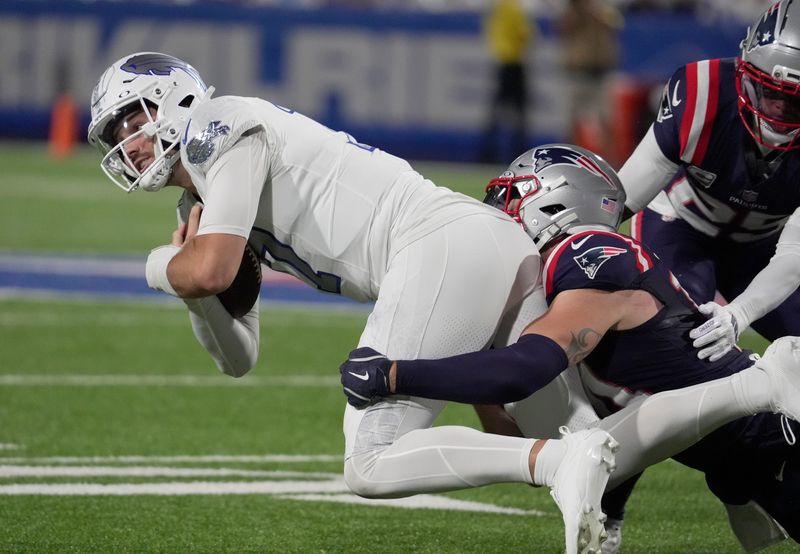 Buffalo Bills quarterback Josh Allen, running with the ball, gets brought down by New England Patriots linebacker Robert Spillane during first half action at Highmark Stadium in Orchard Park on Oct. 5, 2025.