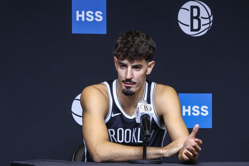 Sep 23, 2025; Brooklyn, NY, USA; Brooklyn Nets guard Ben Saraf (77) speaks at Media Day. Mandatory Credit: Wendell Cruz-Imagn Images