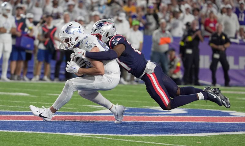Buffalo Bills tight end Dalton Kincaid gets tackled from behind by New England Patriots safety Jaylinn Hawkins during first half action at Highmark Stadium in Orchard Park on Oct. 5, 2025.