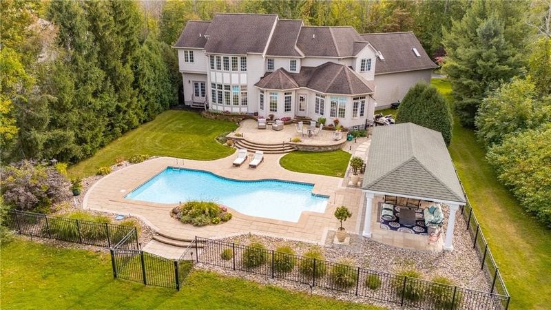 This lakeside mansion at 22 N. Shore Drive in Parma has a saltwater pool on the 2.15-acre property.