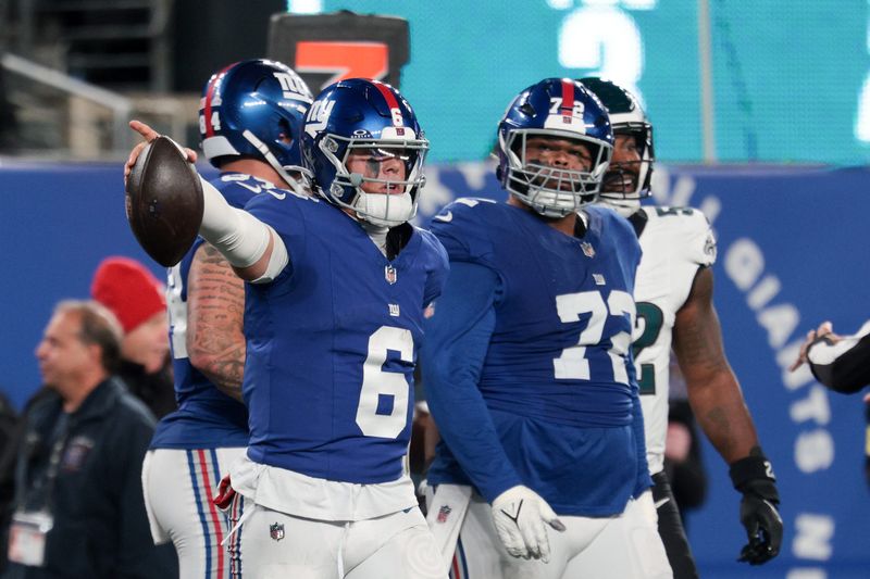 Oct 9, 2025; East Rutherford, New Jersey, USA; New York Giants quarterback Jaxson Dart (6) celebrates a first down against the Philadelphia Eagles during the third quarter of the game at MetLife Stadium. Mandatory Credit: Vincent Carchietta-Imagn Images
