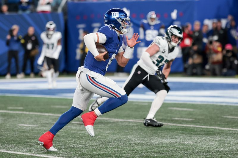 Oct 9, 2025; East Rutherford, New Jersey, USA; New York Giants quarterback Jaxson Dart (6) scrambles for a touchdown against the Philadelphia Eagles during the first quarter of the game at MetLife Stadium. Mandatory Credit: Vincent Carchietta-Imagn Images