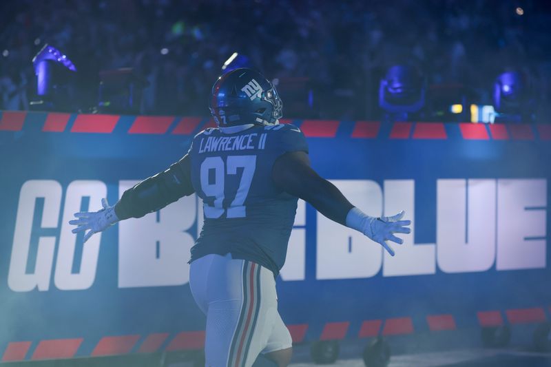Oct 9, 2025; East Rutherford, New Jersey, USA; New York Giants defensive tackle Dexter Lawrence II (97) runs onto the field prior to the game against the Philadelphia Eagles at MetLife Stadium. Mandatory Credit: Vincent Carchietta-Imagn Images