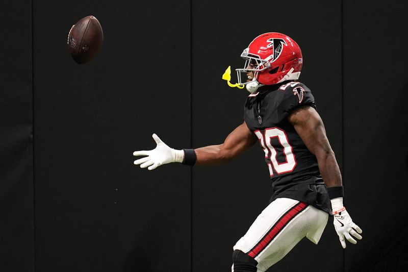 Oct 13, 2025; Atlanta, Georgia, USA; Atlanta Falcons cornerback Dee Alford (20) flips the ball into the stands after an interception against the Buffalo Bills during the first half of a game at Mercedes-Benz Stadium. Mandatory Credit: Dale Zanine-Imagn Images