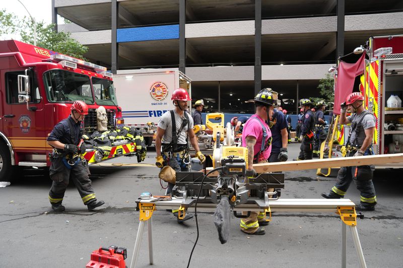 Rescue workers from several Westchester County agencies assist White Plains firefighters at the scene of a partial structural collapse in a parking garage on Hale Avenue in White Plains Oct. 15, 2025. Several cars were damaged in the collapse, and there were no reported injuries.