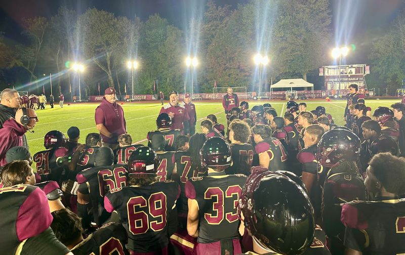 Coach Joe Spagnolo addresses his Iona Prep football team after its loss to Monsignor Farrell on Oct. 17, 2025.