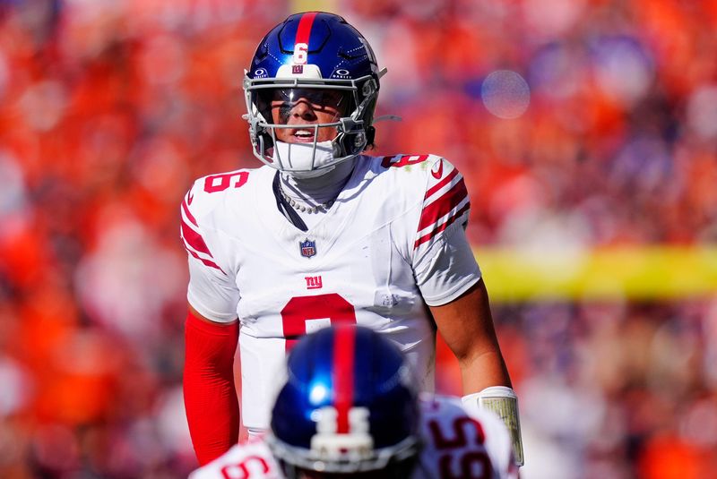 Oct 19, 2025; Denver, Colorado, USA; New York Giants quarterback Jaxson Dart (6) reacts after a play during the first half against the Denver Broncos at Empower Field at Mile High. Mandatory Credit: Ron Chenoy-Imagn Images