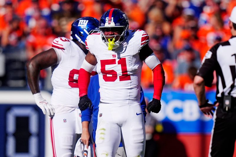 Oct 19, 2025; Denver, Colorado, USA; New York Giants linebacker Abdul Carter (51) reacts after a play against the Denver Broncos during the second half at Empower Field at Mile High. Mandatory Credit: Ron Chenoy-Imagn Images