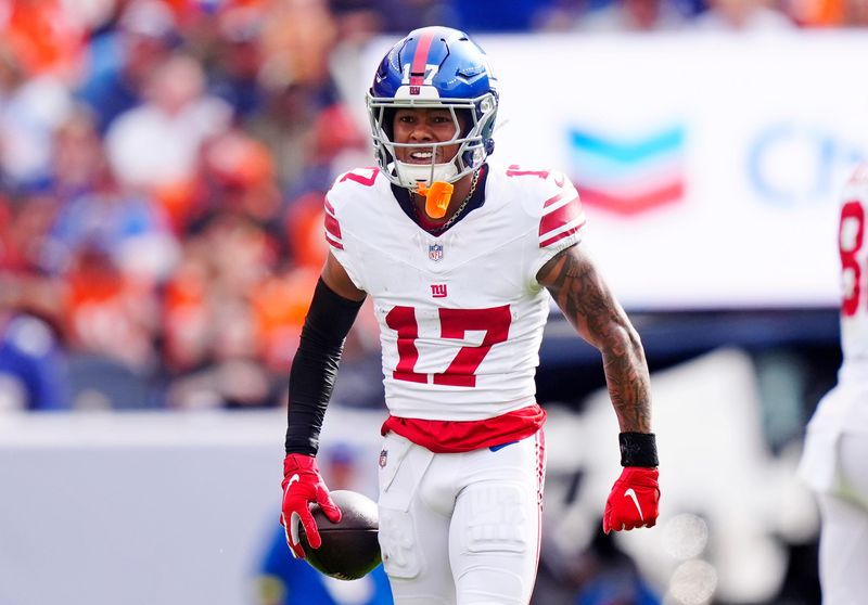 Oct 19, 2025; Denver, Colorado, USA; New York Giants wide receiver Wan'Dale Robinson (17) reacts after a play during the second half against the Denver Broncos at Empower Field at Mile High. Mandatory Credit: Ron Chenoy-Imagn Images