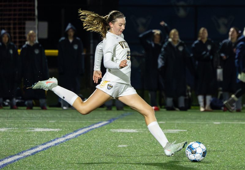 Victor;s Morgan Karnyski takes a free kick Wednesday, Oct. 22 at Webster Schroeder High School.
