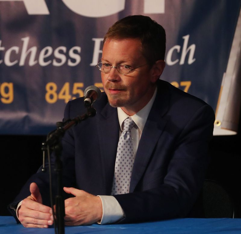 Dutchess County Comptroller Dan Aymar-Blair on stage at the Cunneen-Hackett Theater for the Northern Dutchess NAACP Meet the Candidates event on October 22, 2025.