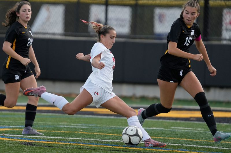 Penfield’s Hannah D'Imperio winds up and blasts a shot on the Athena goal in the second half during their Section V Class AA girls soccer quarterfinals Sat, October 25, 2025 at Greece Athena High School.