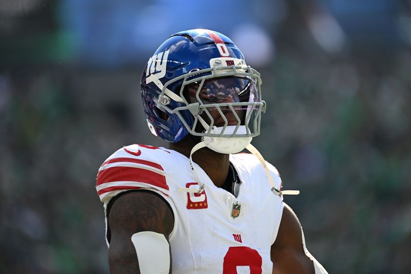 Oct 26, 2025; Philadelphia, Pennsylvania, USA; New York Giants linebacker Brian Burns (0) looks on in the first quarter against the Philadelphia Eagles at Lincoln Financial Field. Mandatory Credit: Eric Hartline-Imagn Images