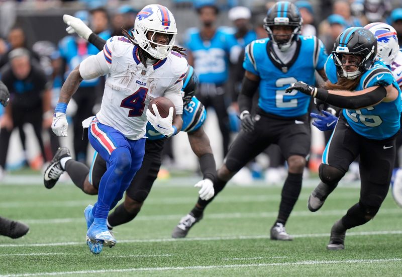 Oct 26, 2025; Charlotte, North Carolina, USA; Buffalo Bills running back James Cook III (4) scores a touchdown during the second half against the Carolina Panthers at Bank of America Stadium. Mandatory Credit: Jim Dedmon-Imagn Images