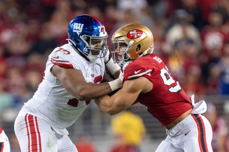 September 21, 2023; Santa Clara, California, USA; New York Giants offensive tackle Evan Neal (73) blocks San Francisco 49ers defensive end Nick Bosa (97) during the fourth quarter at Levi's Stadium. Mandatory Credit: Kyle Terada-USA TODAY Sports