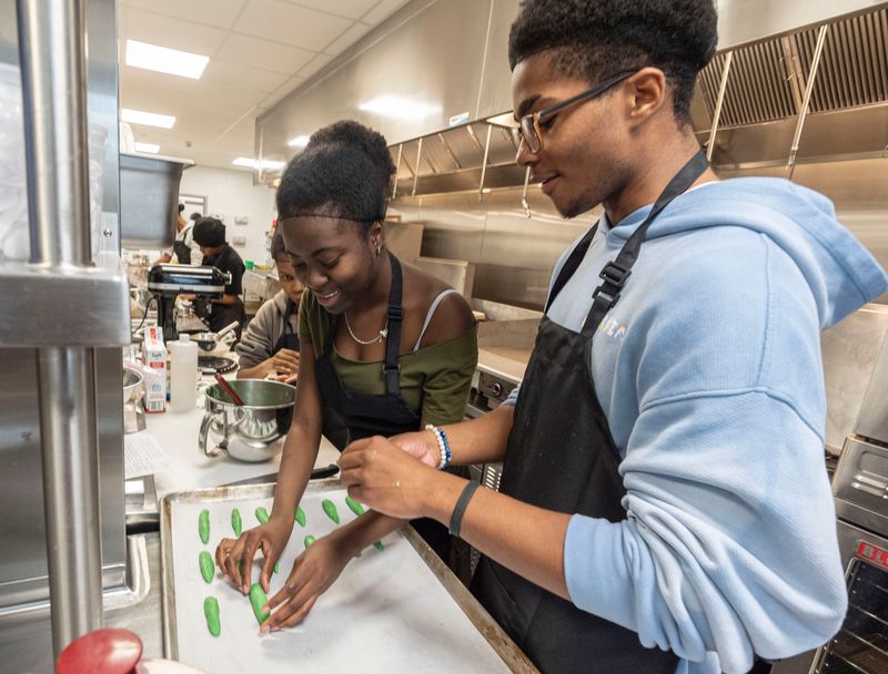 Rihanna Johnson and Asher Nicholson, seniors at Mount Vernon High School, make Witch Finger Cookies during their Culinary Arts class Oct. 30, 2025. Students in the culinary class were making an assortment of Halloween themed baked goods just before the holiday. The New York State Department of Education has renewed the high school's culinary program through 2030.