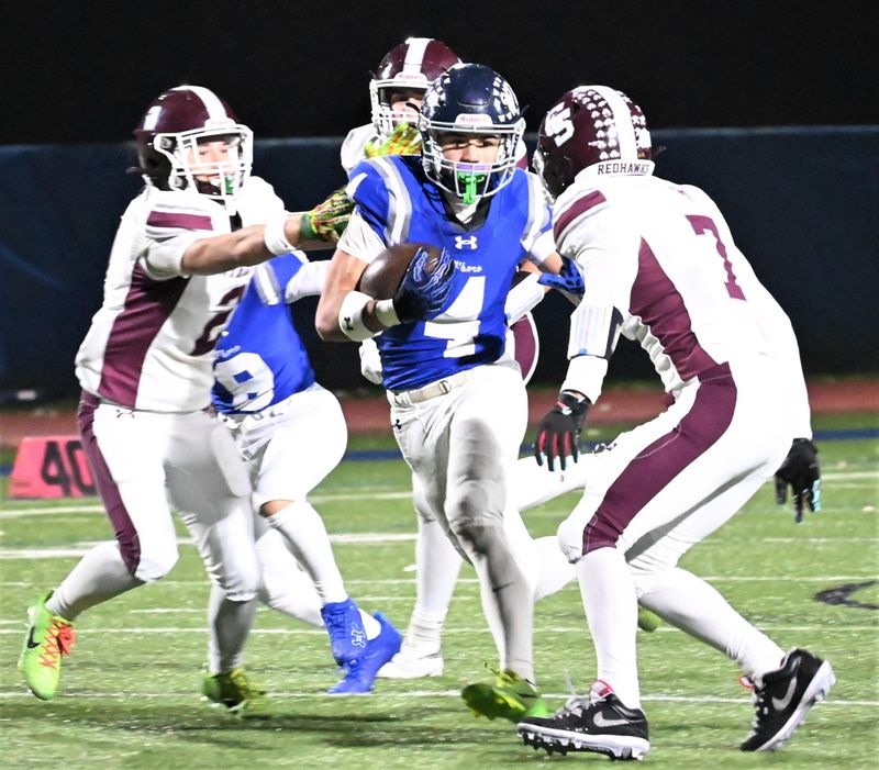 Whitesboro ball-carrier Connor McDonald hits the hole on a second quarter run against the Central Square Redhawks Thursdayduring a Section III quarterfinal playoff game at the Ed Wadas Athletic Complex in Marcy. McDonald scored a career-high six touchdowns in a 49-21 victory for the No. 1 seed in Class A.