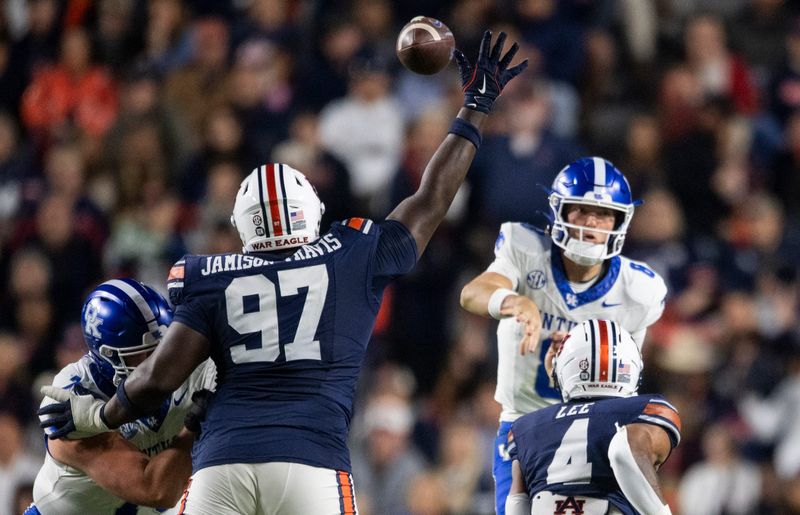 Auburn Tigers defensive lineman Bobby Jamison-Travis (97) deflects a pass from Kentucky Wildcats quarterback Cutter Boley (8) as Auburn Tigers take on Kentucky Wildcats at Jordan-Hare Stadium in Auburn, Ala. on Saturday, Nov. 1, 2025. Auburn Tigers and Kentucky Wildcats are tied 3-3 at halftime.