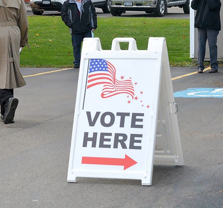 A sign directs voters to a polling place in the Corning area.