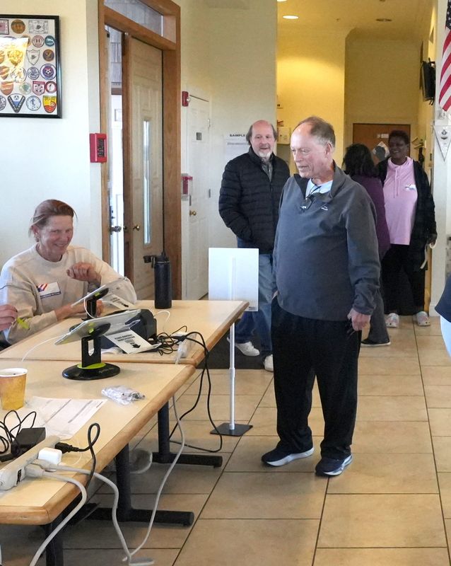 Bruce Bortniker signs in to vote at the Orangetown Soccer Complex in Orangeburg Nov. 4, 2025.