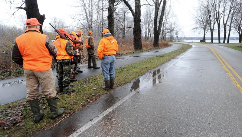 Hunters gather at Presque Isle State Park near the entrance to the East Pier on Dec. 7, 2011, during the first day of deer hunting at the park.