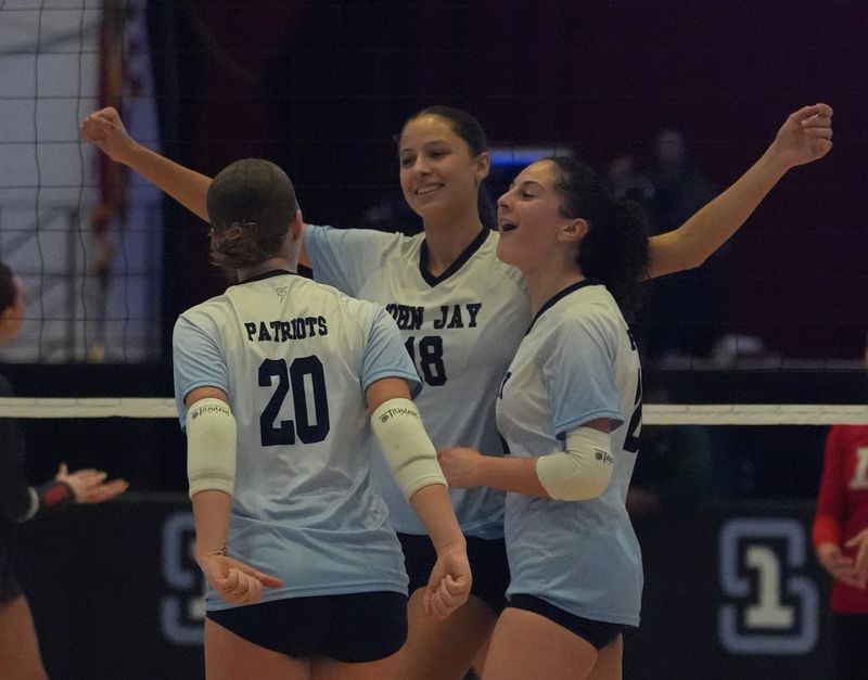 John Jay-East Fishkill teammates celebrate a point during the Section 1 Class AAA final on Nov. 9, 2025. The Patriots have since advanced to the regional final and will compete upstate on Nov. 15.