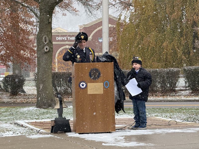 Six-year-old Noah Spaulding sings at a Veterans Day ceremony Tuesday at Veterans Memorial Park, off Park Avenue, in Corning.