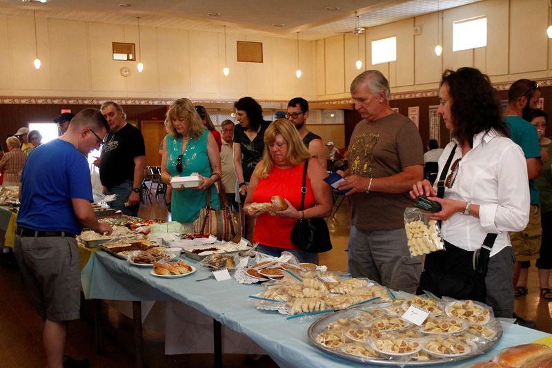 In July 2016, festival attendees sample food at St. John's annual Ukrainian Days Festival in Johnson City.