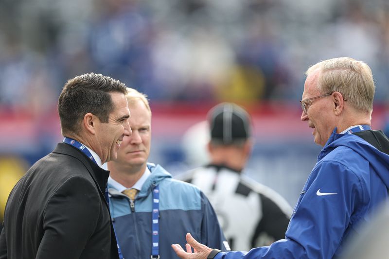 Dec 29, 2024; East Rutherford, New Jersey, USA; New York Giants owner John Mara, right, and general manager Joe Schoen, left, talk before the game against the Indianapolis Colts at MetLife Stadium. Mandatory Credit: Vincent Carchietta-Imagn Images