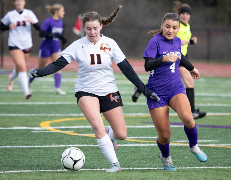Churchville-Chili's Madison Mastrodonato runs upfield while Warwick's Reese Girardi pursues during the NYSPHSAA Class AA semifinals Saturday, Nov. 15 at Dryden High School.