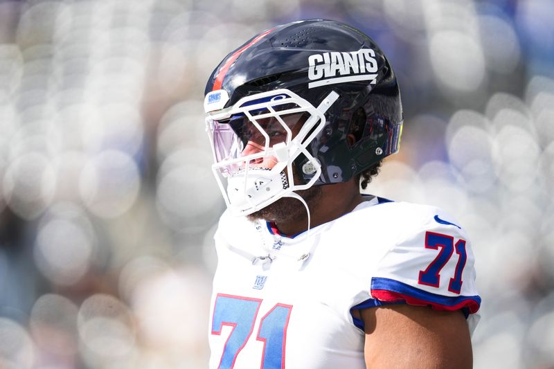 New York Giants guard Marcus Mbow (71) warms up before a game against the Green Bay Packers at MetLife Stadium, Nov 16, 2025, East Rutherford, NJ, USA.