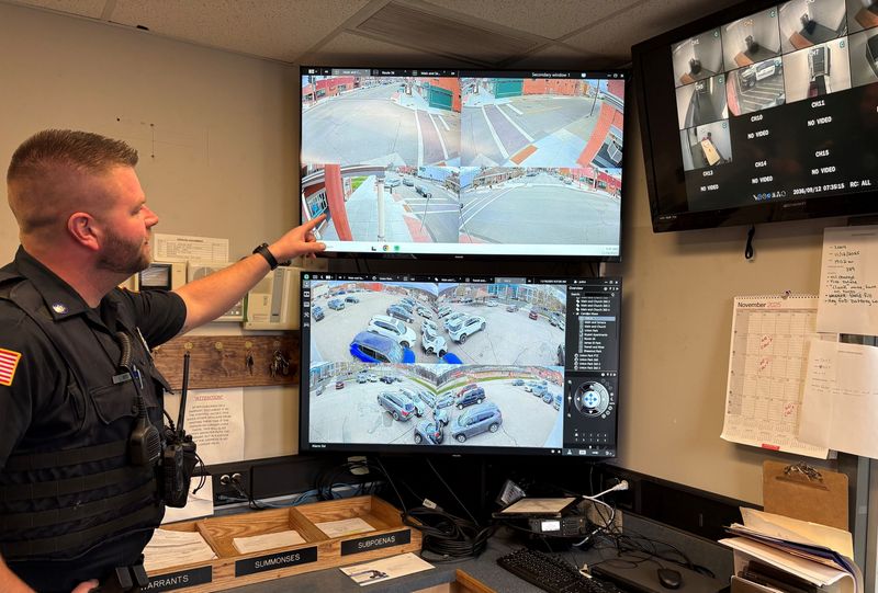 Hornell police officer Eric Kerr monitors live video feeds from around the city in the department's dispatch center on Nov. 18, 2025.