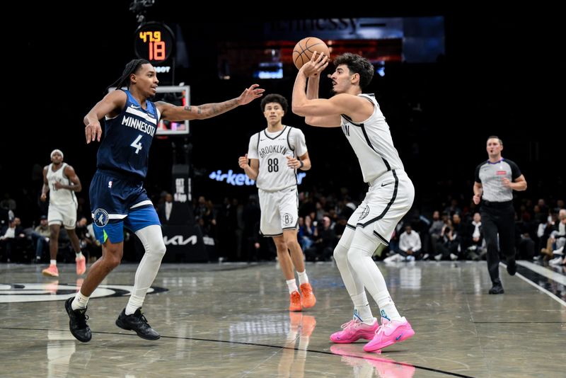 Nov 3, 2025; Brooklyn, New York, USA; Brooklyn Nets guard Ben Saraf (77) shoots against Minnesota Timberwolves guard Rob Dillingham (4) during the second half at Barclays Center. Mandatory Credit: John Jones-Imagn Images