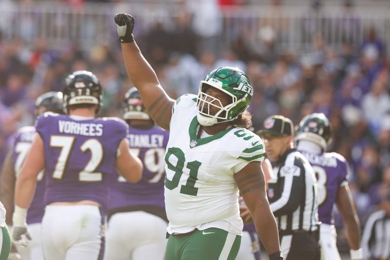 Nov 23, 2025; Baltimore, Maryland, USA; New York Jets defensive tackle Jowon Briggs (91) celebrates a sack during the second quarter against the Baltimore Ravens at M&T Bank Stadium. Mandatory Credit: Peter Casey-Imagn Images