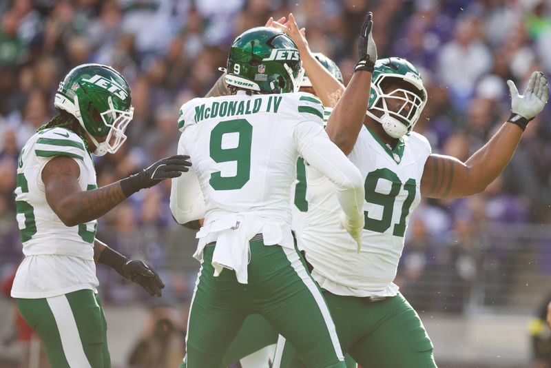 Nov 23, 2025; Baltimore, Maryland, USA; New York Jets defensive tackle Jowon Briggs (91) and New York Jets defensive end Will McDonald IV (9) celebrate a sack during the second quarter against the Baltimore Ravens at M&T Bank Stadium. Mandatory Credit: Peter Casey-Imagn Images