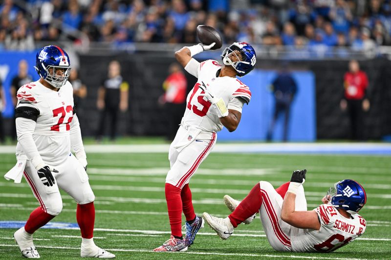 Nov 23, 2025; Detroit, Michigan, USA; New York Giants quarterback Jameis Winston (19) throws a touchdown pass on a flea flicker against the Detroit Lions in the first quarter at Ford Field. Mandatory Credit: Lon Horwedel-Imagn Images
