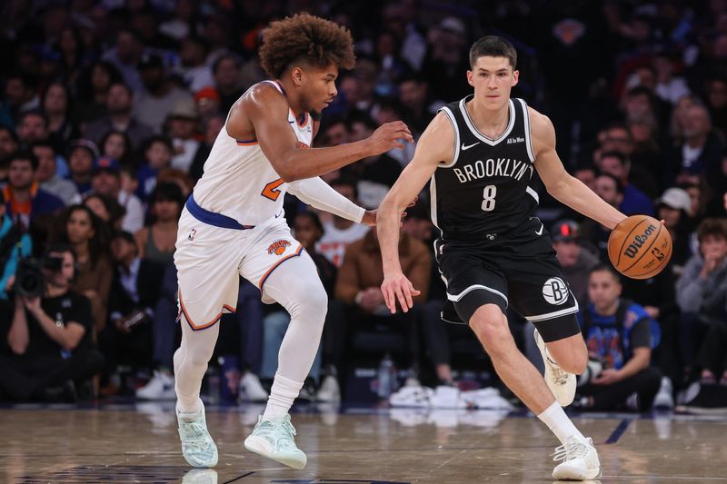 Nov 9, 2025; New York, New York, USA; Brooklyn Nets guard Egor Demin (8) looks to drive past New York Knicks guard Miles McBride (2) in the fourth quarter at Madison Square Garden. Mandatory Credit: Wendell Cruz-Imagn Images