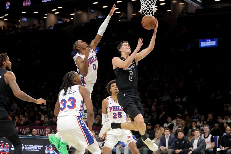 Nov 28, 2025; Brooklyn, New York, USA; Brooklyn Nets guard Egor Demin (8) drives to the basket against Philadelphia 76ers forward Jabari Walker (33) and guard Tyrese Maxey (0) and forward Dominick Barlow (25) during the third quarter at Barclays Center. Mandatory Credit: Brad Penner-Imagn Images