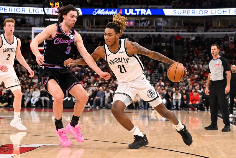 Dec 3, 2025; Chicago, Illinois, USA; Brooklyn Nets forward Noah Clowney (21) dribbles against Chicago Bulls guard Josh Giddey (3) during the second half at the United Center. Mandatory Credit: Matt Marton-Imagn Images