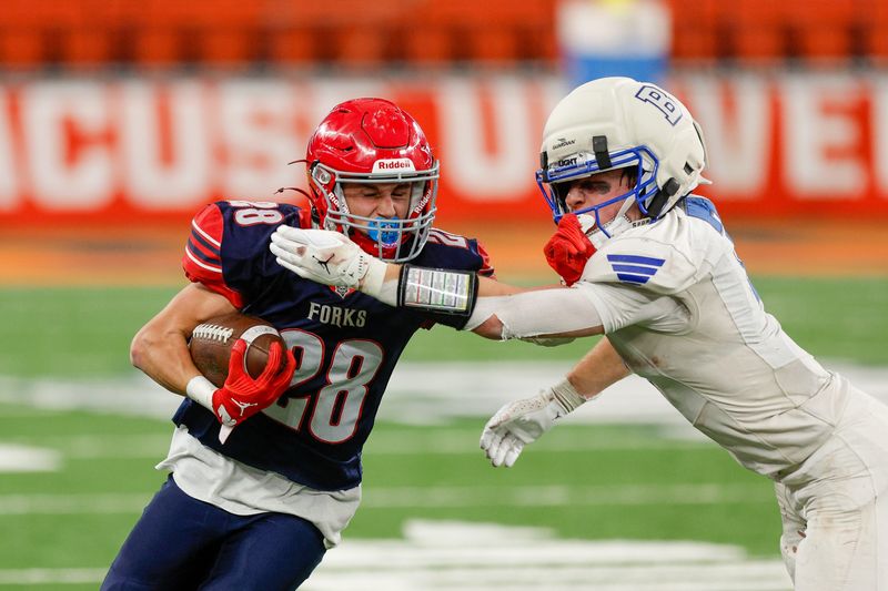 Tate Bender runs with the ball for Chenango Forks during a 42-25 loss to Bronxville in the NYSPHSAA Class C football championship game Dec. 6, 2025 at the JMA Wireless Dome in Syracuse.