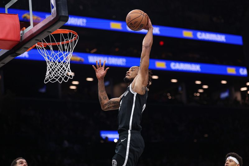 Dec 6, 2025; Brooklyn, New York, USA; Brooklyn Nets center Nic Claxton (33) goes up for a dunk during the second half against the New Orleans Pelicans at Barclays Center. Mandatory Credit: Vincent Carchietta-Imagn Images