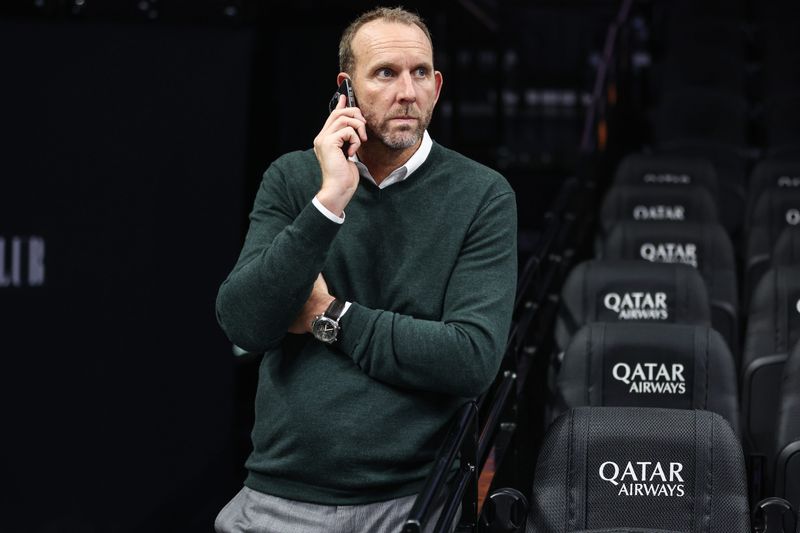 Oct 29, 2025; Brooklyn, New York, USA; Brooklyn Nets General Manager Sean Marks looks on during warmups prior to the game against the Atlanta Hawks at Barclays Center. Mandatory Credit: Wendell Cruz-Imagn Images