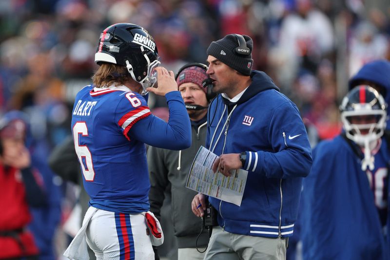 Dec 14, 2025; East Rutherford, New Jersey, USA; New York Giants quarterback Jaxson Dart (6) talks with interim head coach Mike Kafka during the fourth quarter against the Washington Commanders at MetLife Stadium. Mandatory Credit: Vincent Carchietta-Imagn Images