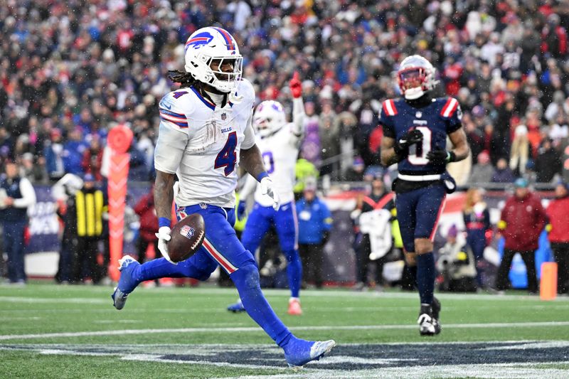 Dec 14, 2025; Foxborough, Massachusetts, USA; Buffalo Bills running back James Cook III (4) runs for a touchdown against the New England Patriots during the second half at Gillette Stadium. Mandatory Credit: Brian Fluharty-Imagn Images