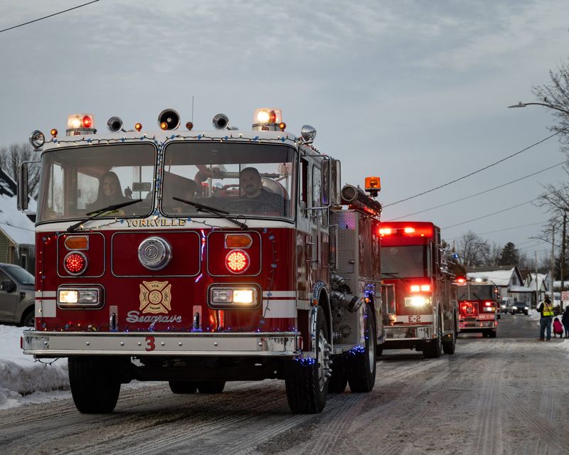 A Yorkville Fire Department truck participates in a first responder parade by Operation Santa’s S.L.E.D. (Support Law Enforcement Drive) for New York State Police Trooper Anthony DeSarro and his family on Tuesday, December 16, 2025 in Yorkville, NY. Gifts were dropped off by several law enforcement agencies to show DeSarro and his family that they are not alone after being diagnosed with aggressive B-cell lymphoma surrounding his heart.