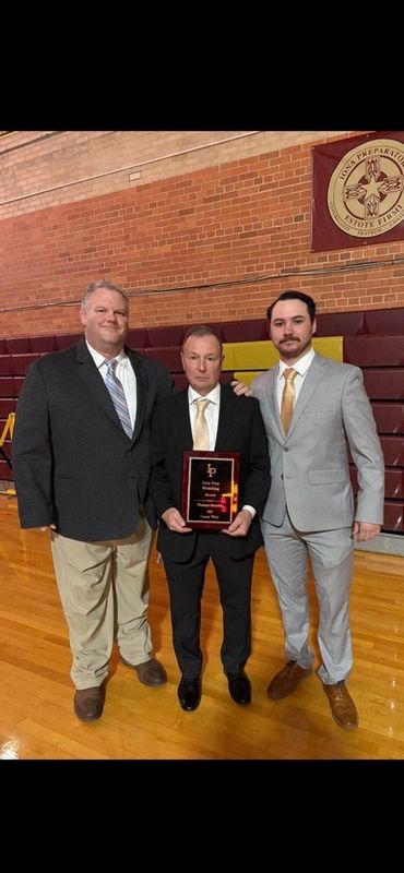 From left to right, Iona Prep wrestling assistant coach John Degl, Iona Prep head coach Tom Straehle and Iona Prep assistant coach Nick Cipriano pose after Straehle got his 300th win.